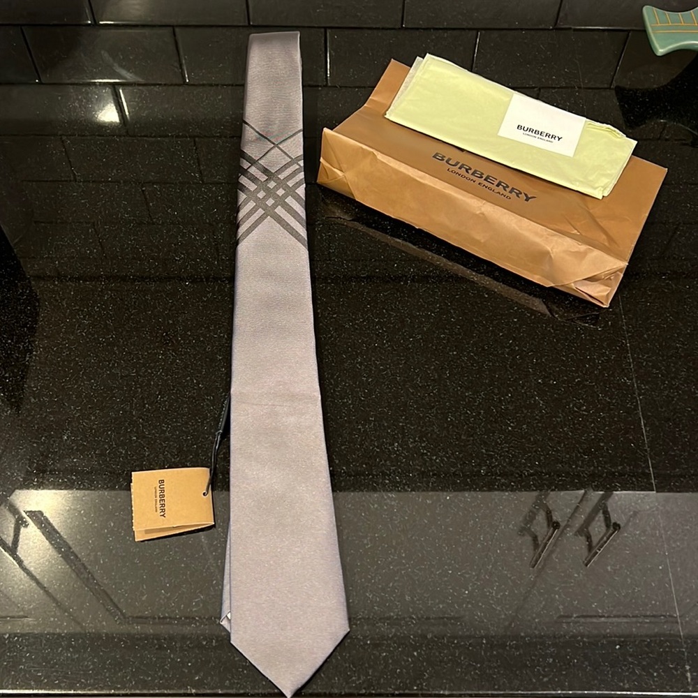 Burberry gray tie. New with tags. Beautiful